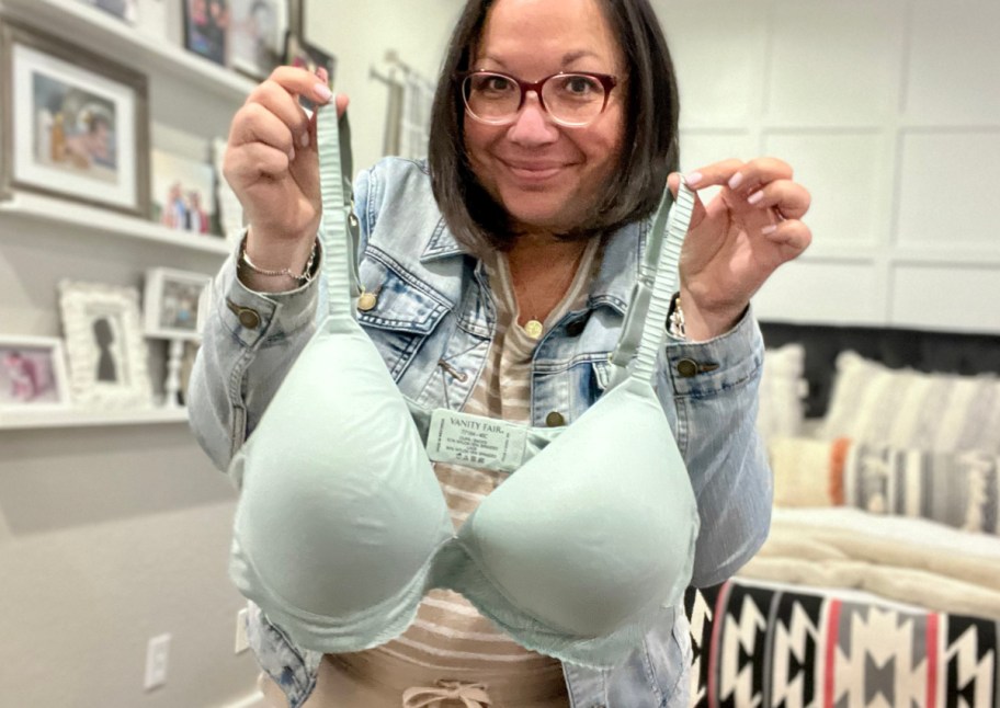 woman holding sage colored bra
