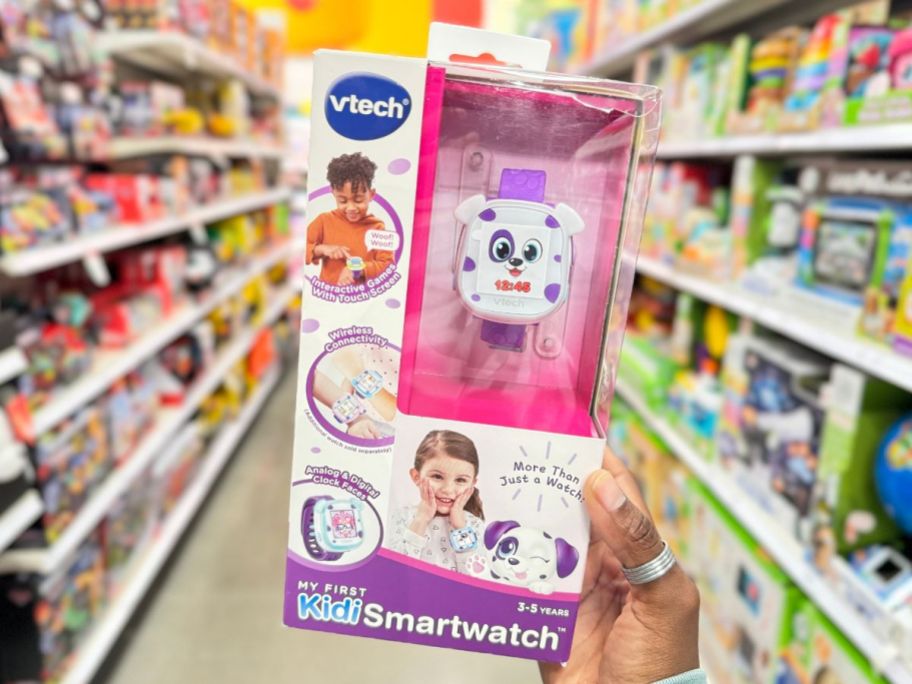 vtech smart watch being held up in store aisle
