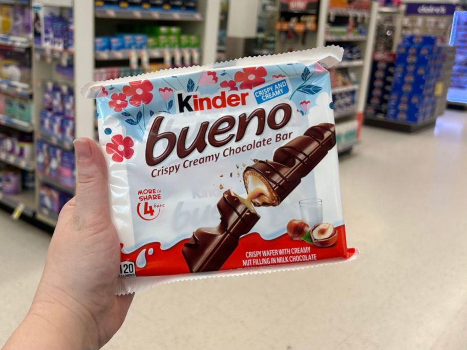 kinder bueno bars being held up in store aisle