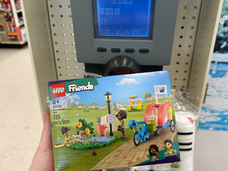 lego set being held up in front of store scanner