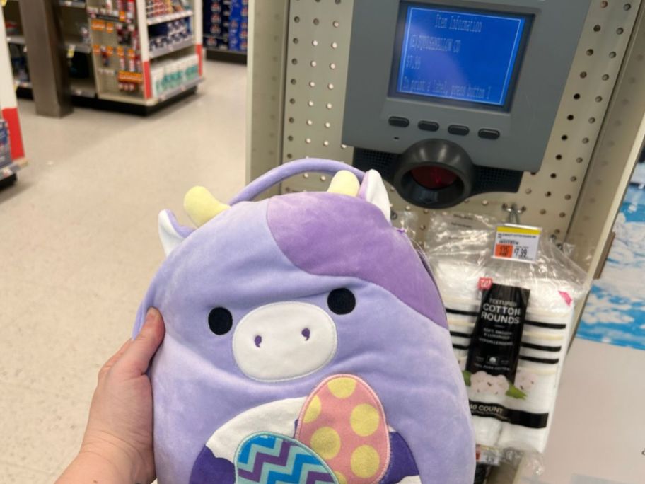 easter squishmallow being held in front of price checker
