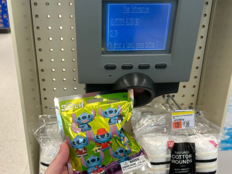 stitch toy being held in front of price scanner