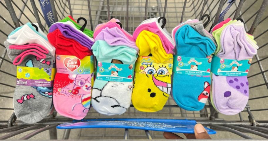 6 six packs of various walmart character socks in a shopping cart