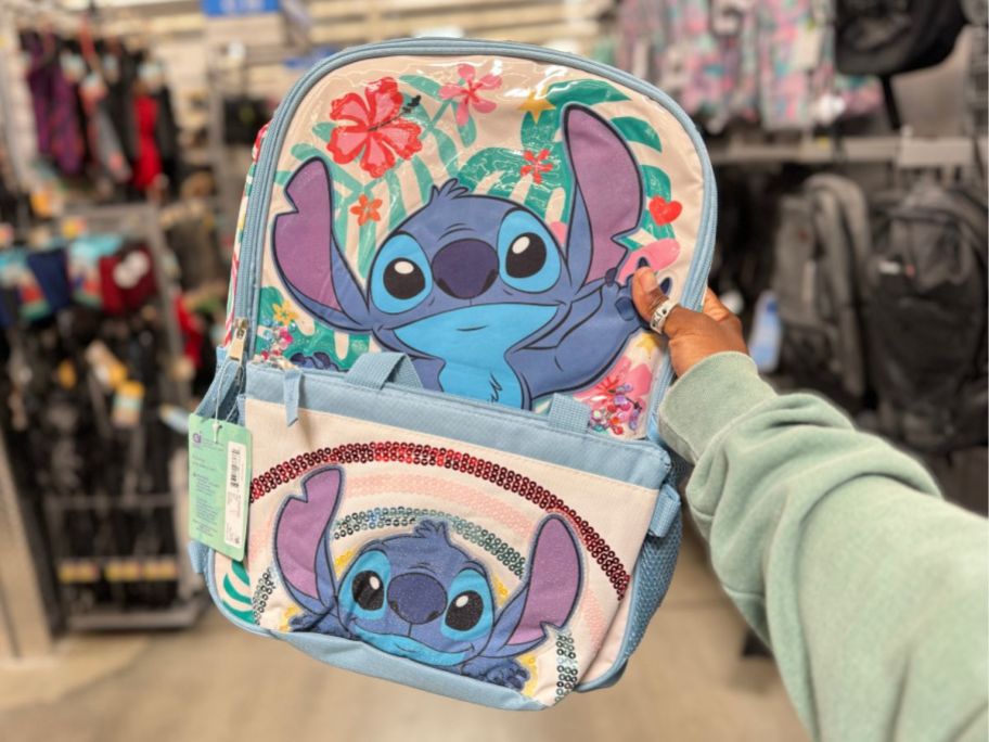 hand holding a Lilo & Stitch kid's backpack and lunch bag set