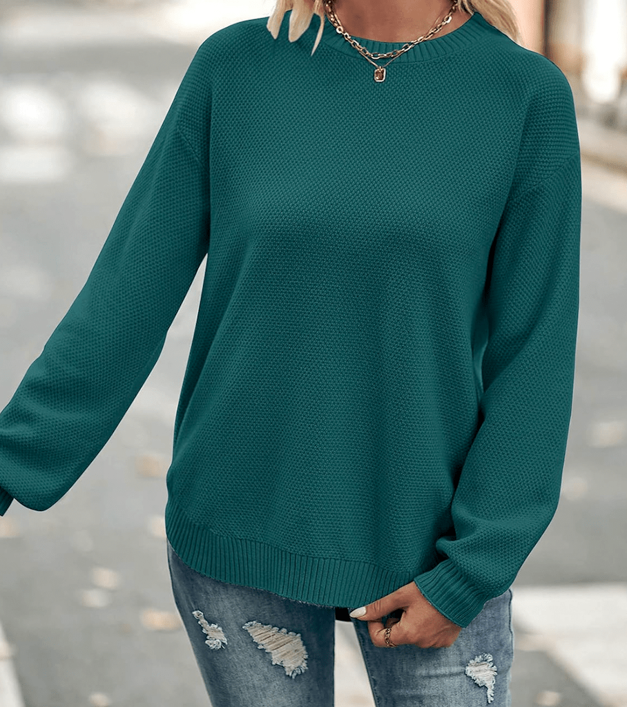 woman wearing turquoise sweater 