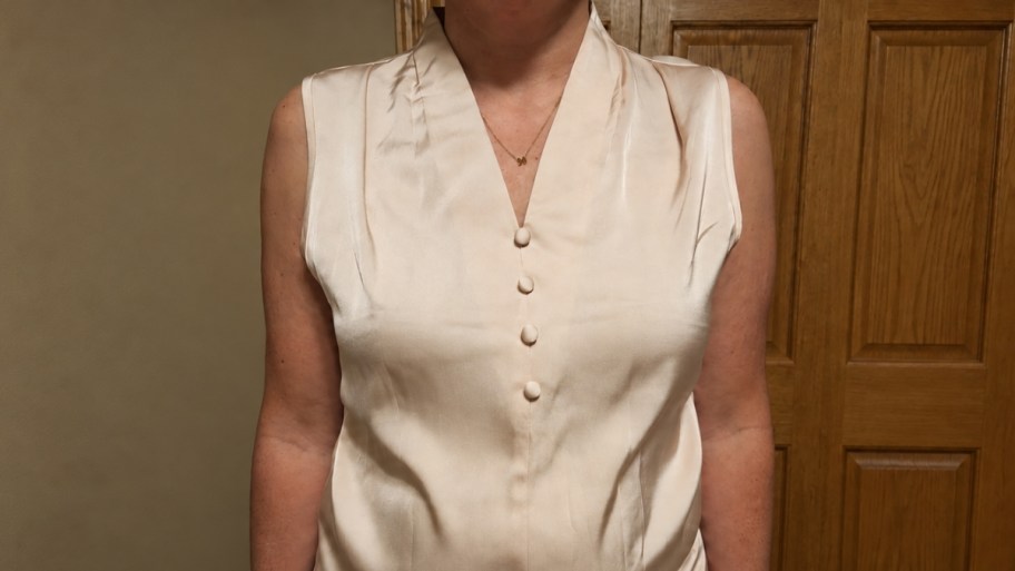 woman in a sleeveless satin ttop