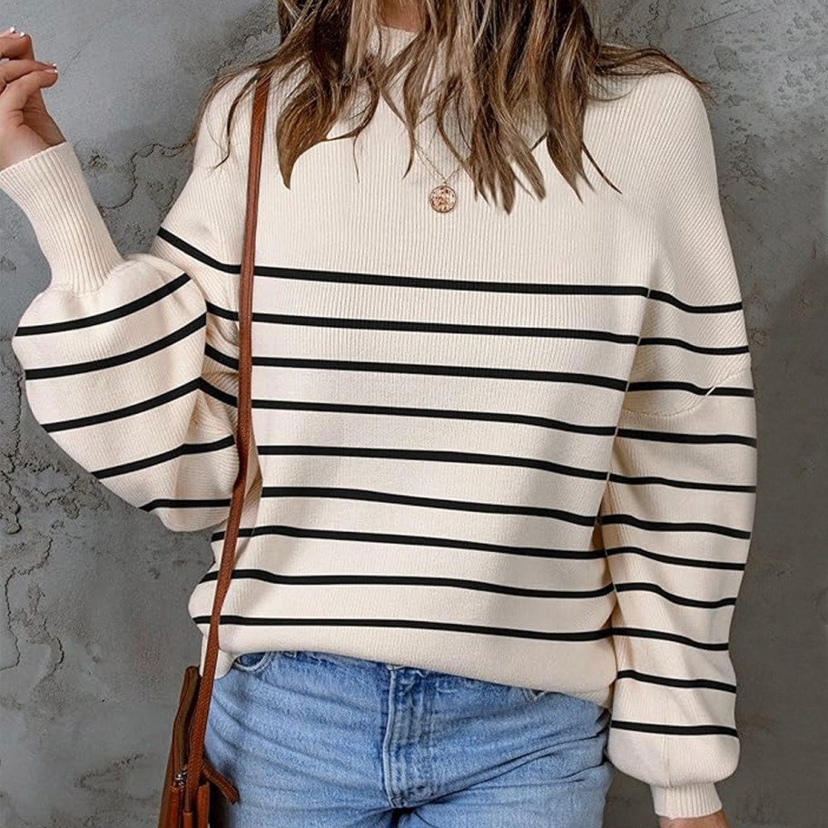 woman wearing beige and black striped turtleneck sweater