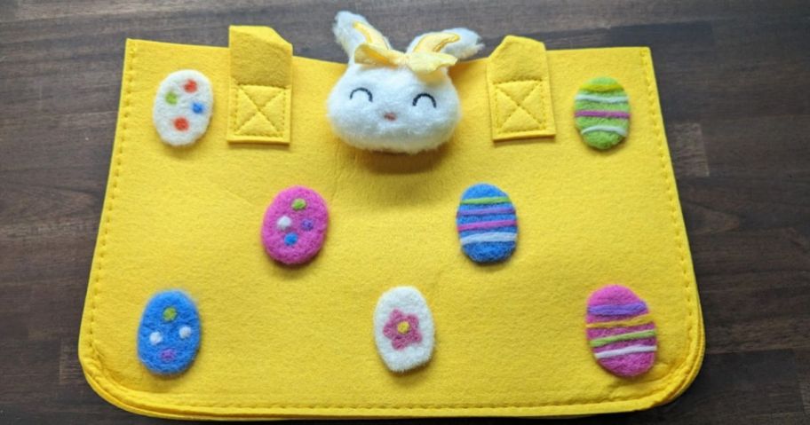 yellow felt Easter bag with plush bunnies and eggs on it