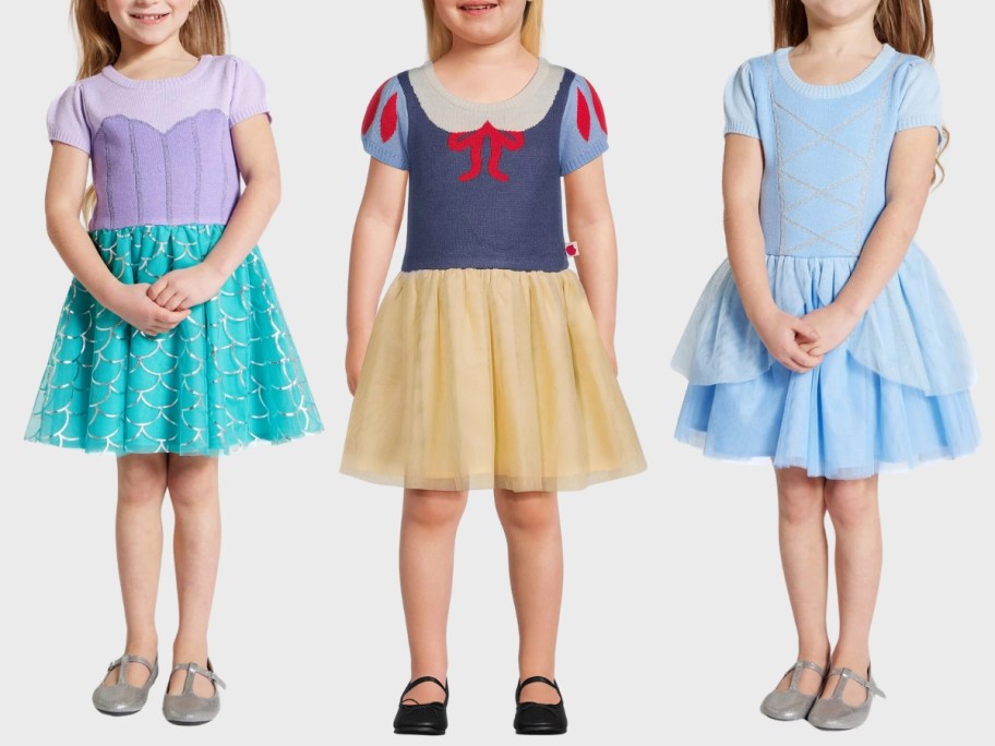little girls wearing Arial, Snow White and Cinderella Disney dresses