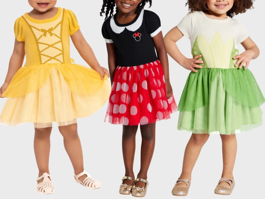 little girls wearing Belle, Minnie Mouse and Tiana Disney dresses