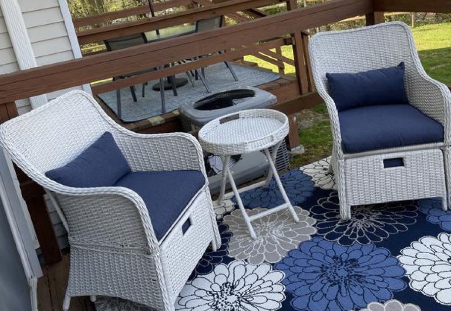 5 piece wicker set displayed on a rug outside