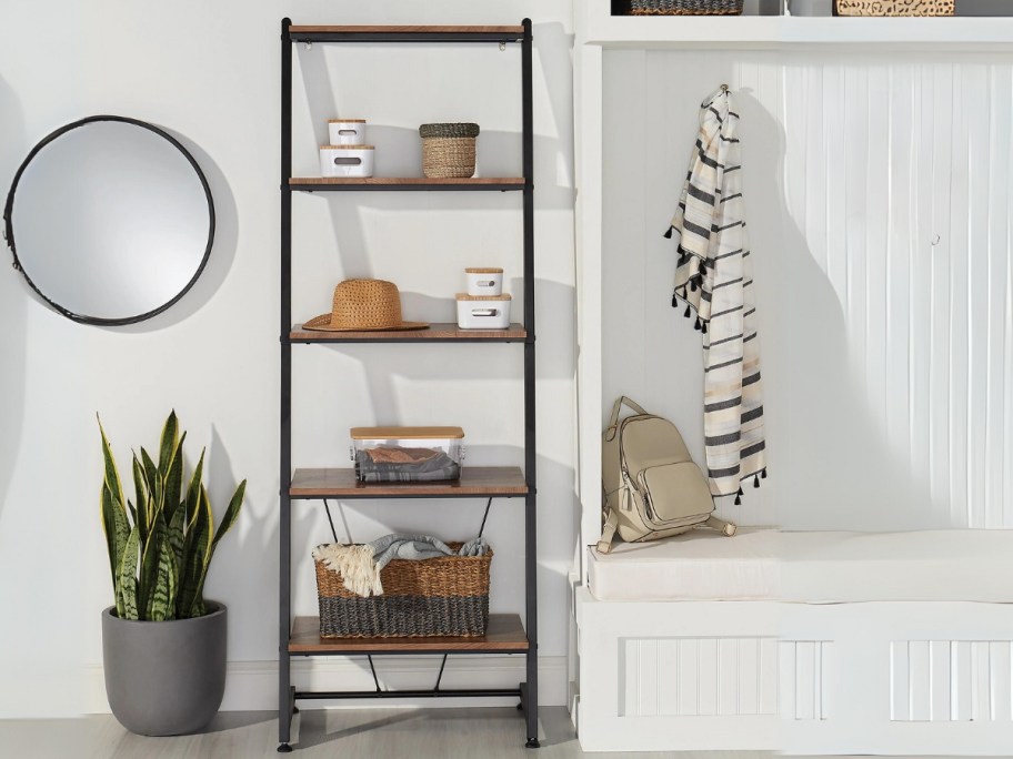 leaning ladder style bookcase in a entry way
