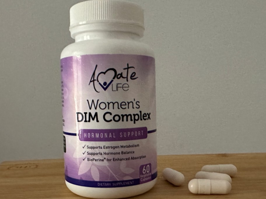 Amate life women's DIM complex with bottle with pills next to it