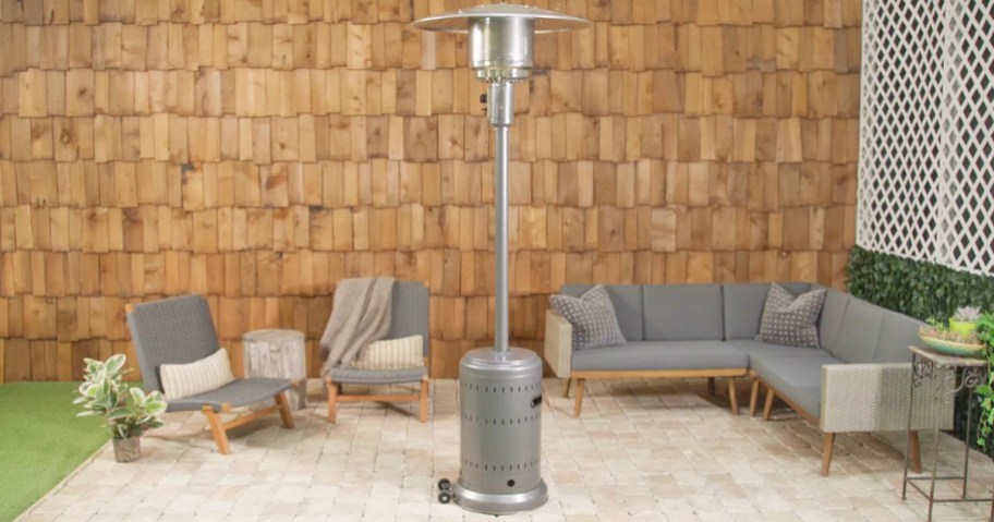 silver patio heater on patio near outdoor couch