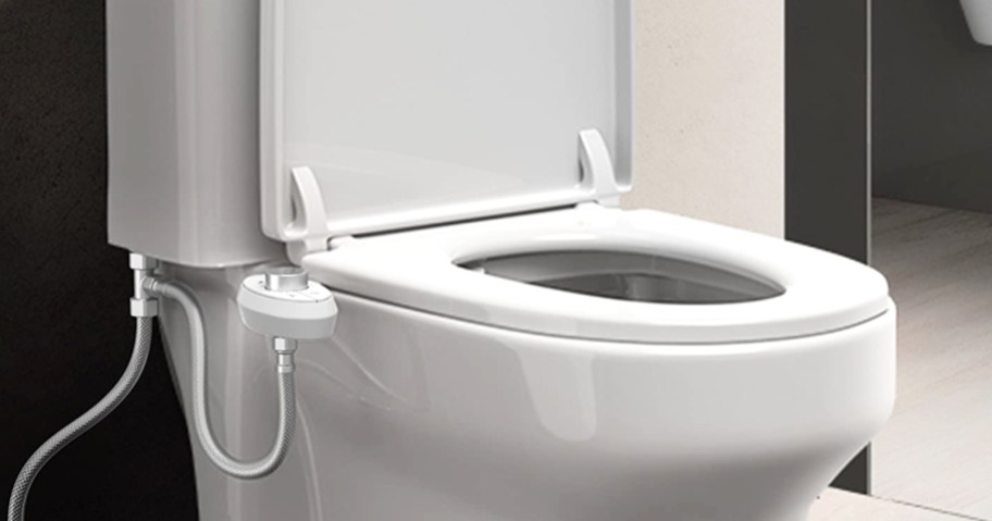 white bidet attachment on a toilet