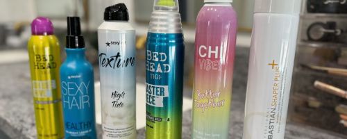 Beauty Brands hair Sprays lined up on a counter