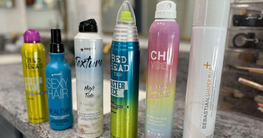 Beauty Brands hair Sprays lined up on a counter