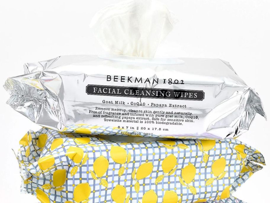2 supersize packs of Beekman 1802 wipes stacked on top of each other with the lid opened and one wipe partially pulled out of the pack.