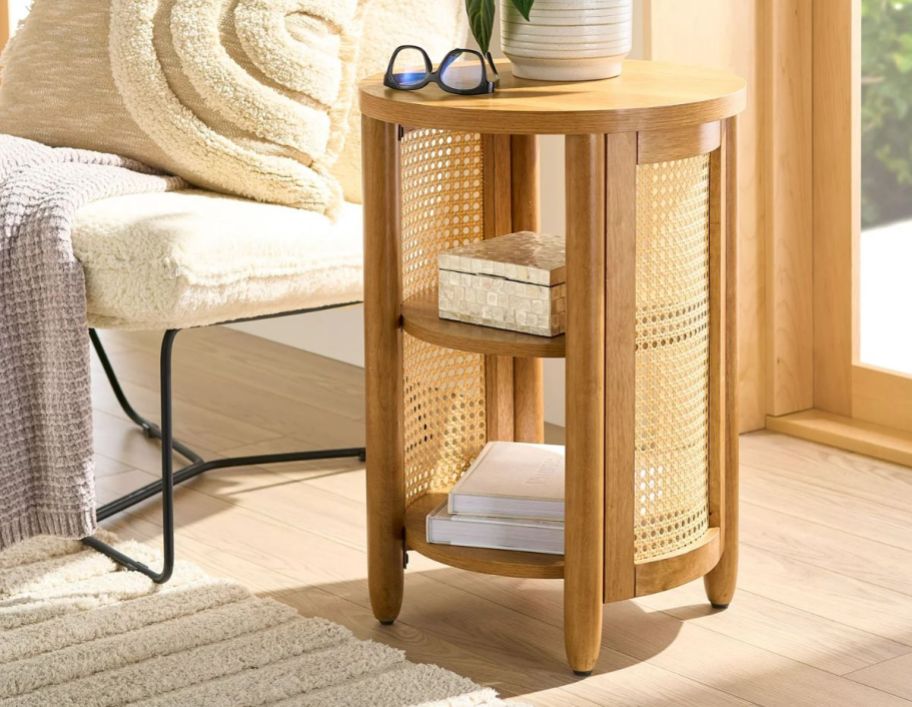 a caning side table next to a sofa