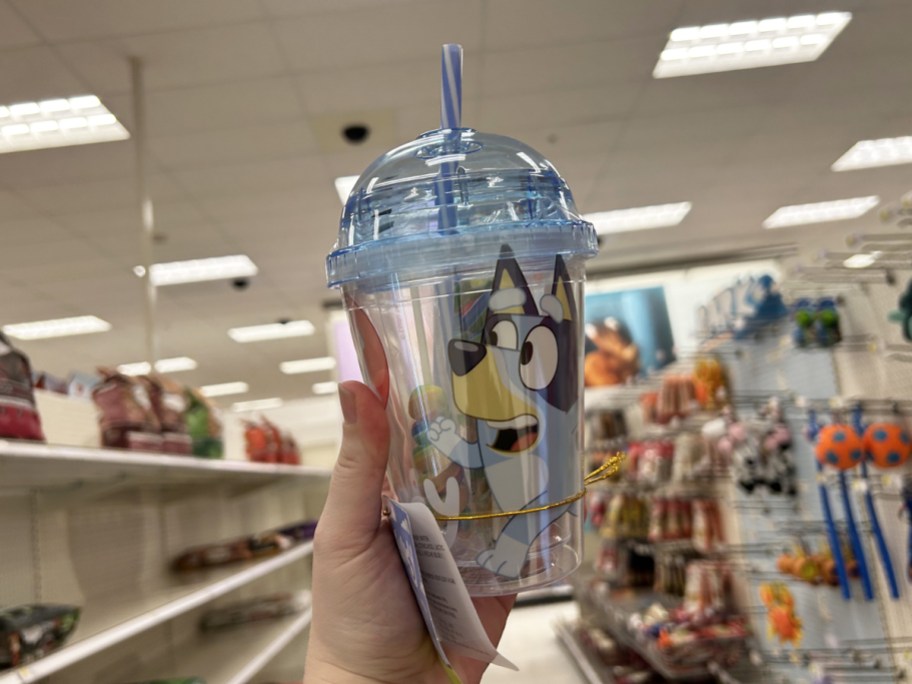 hand holding up Bluey Easter Mini Dome Tumbler in store