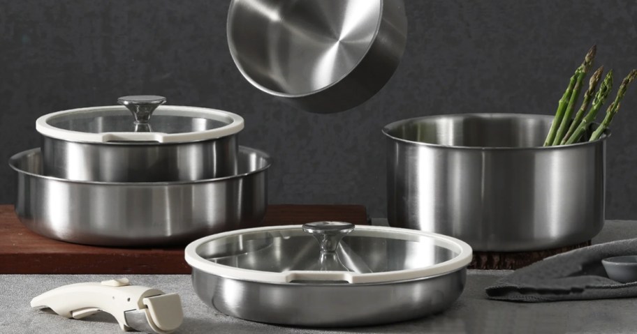 stainless steel pots and pans set on counter