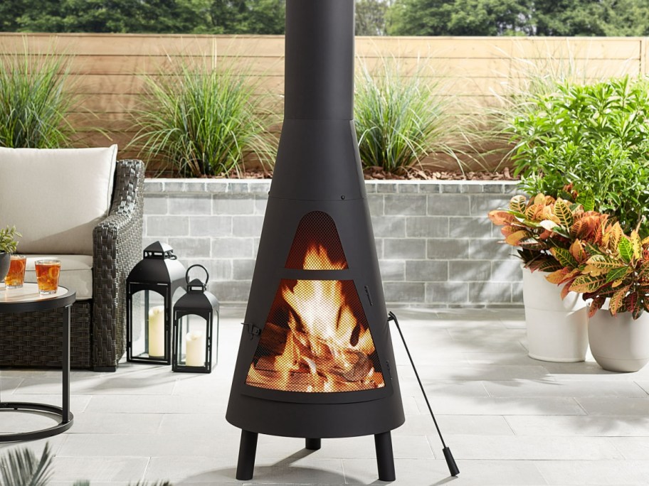 Chiminea with fire and stick