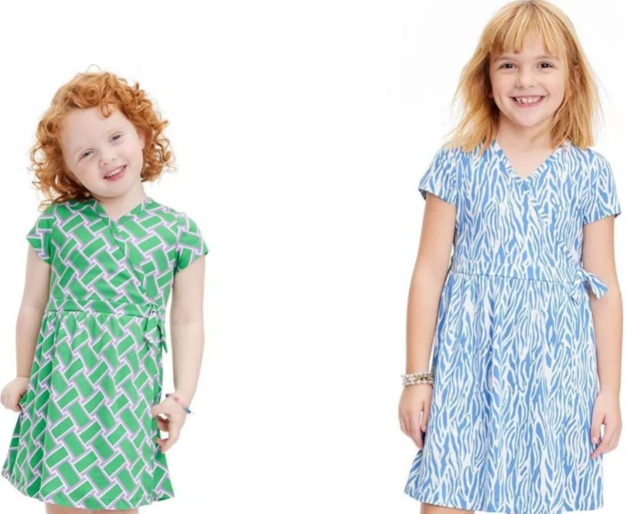 Stock imagess of 2 little girls wearing Diane von Furstenberg for Target wrap dresses