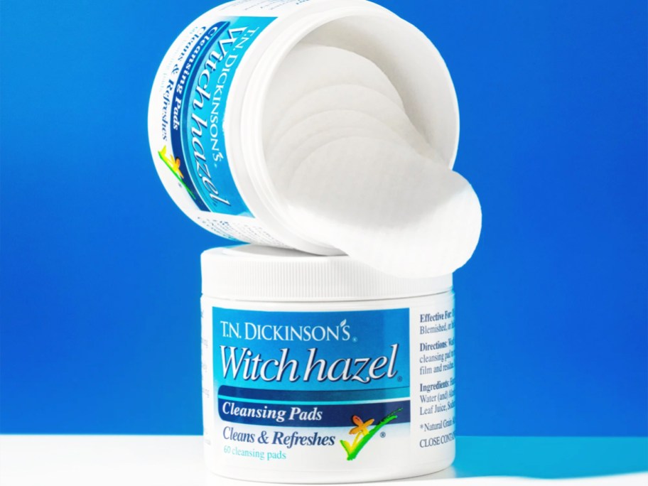 stacked jar of Dickinson's Witch Hazel Cleansing Pads with pads spilling out from the top jar