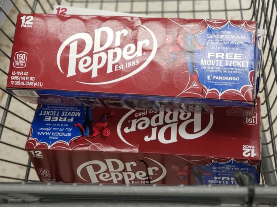 A walgreens shopping cart with 3 12-packs of Dr Pepper Soda