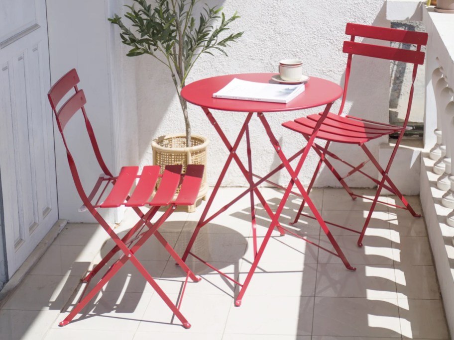 red metal bistro set on balcony