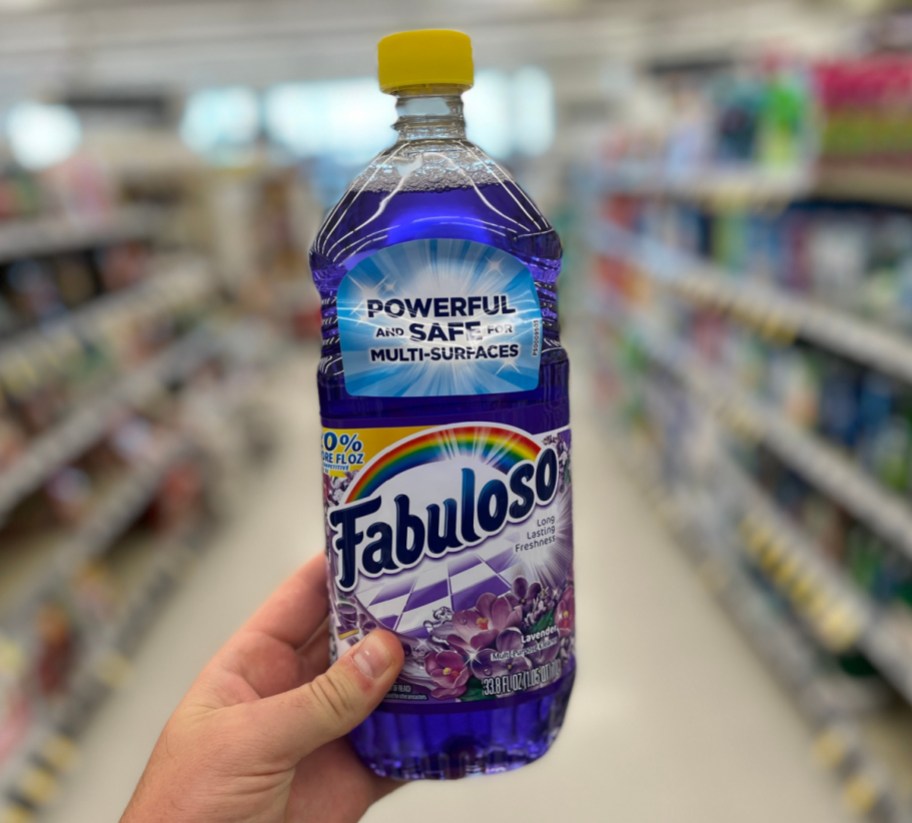 Holding a bottle of fabuloso cleaner