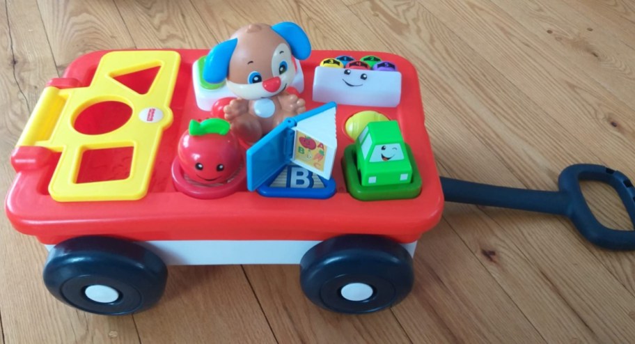 Fisher-Price Laugh & Learn Pull & Play Learning Wagon displayed on the floor
