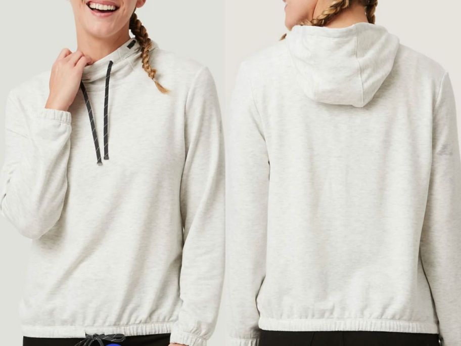 Stock image of a woman wearing a free country luxe easy fit pullover