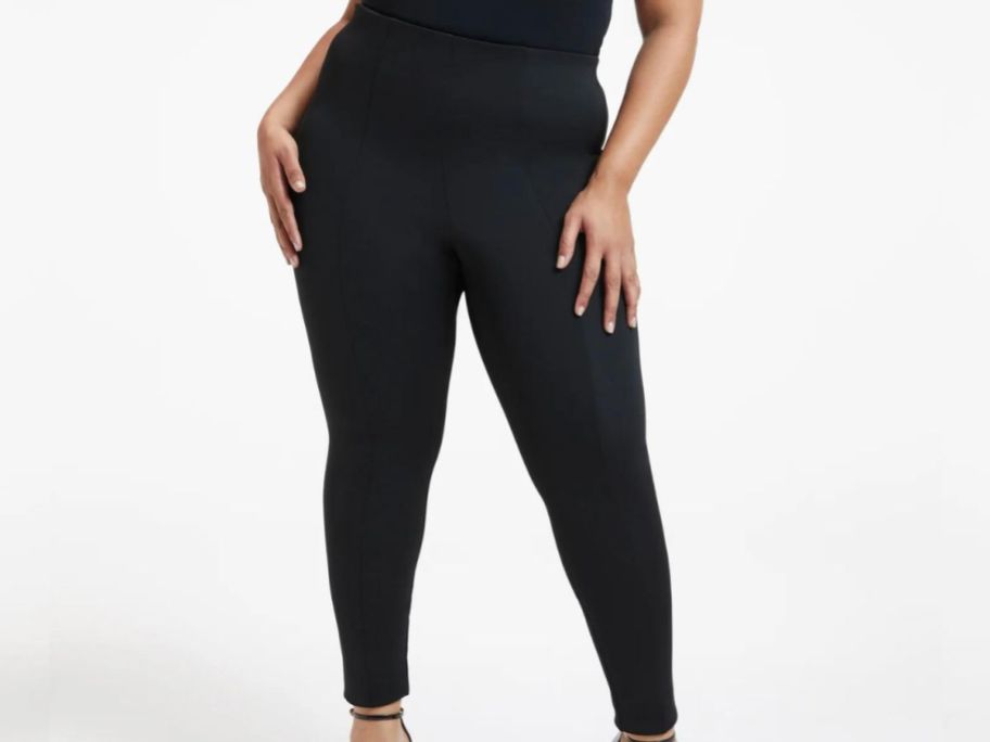 Stock image of a woman wearing a pair of god american skinny leggings