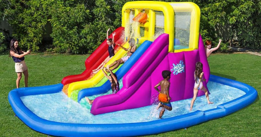 Kids playing on an H20 Go Water Slide