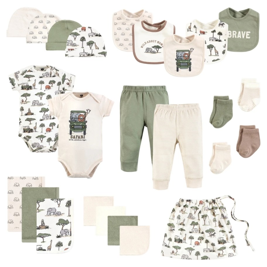 a large set of matching baby clothes and items in greens and tans with jungle animals on them, bodysuits, pants, socks, bibs, hats, burp cloths, and a laundry bag