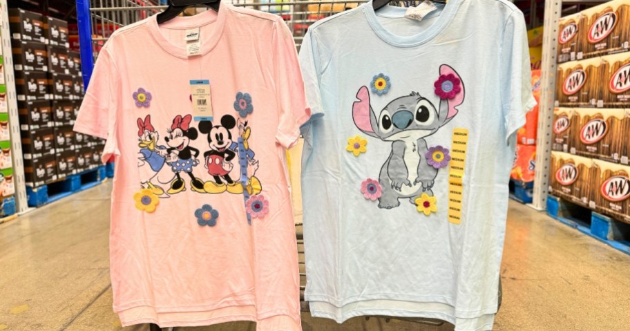 women's Disney Mickey & Minnie T-shirt and Stitch t-shirt hanging from a cart at Sam's Club
