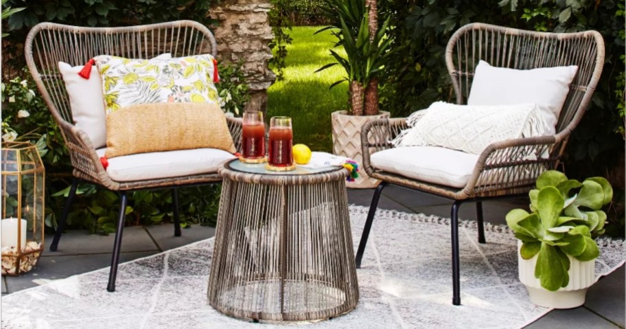 rattan chairs and side table on outdoor patio area