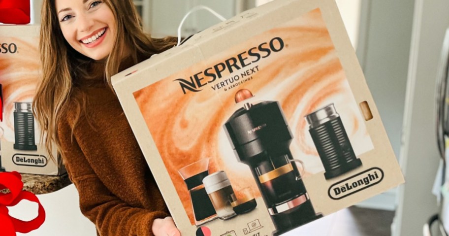 Sara smiling and holding a box for a nespresso vertuo next machine