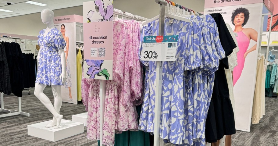 womens colorful dresses on display at Target with a 30% off sign