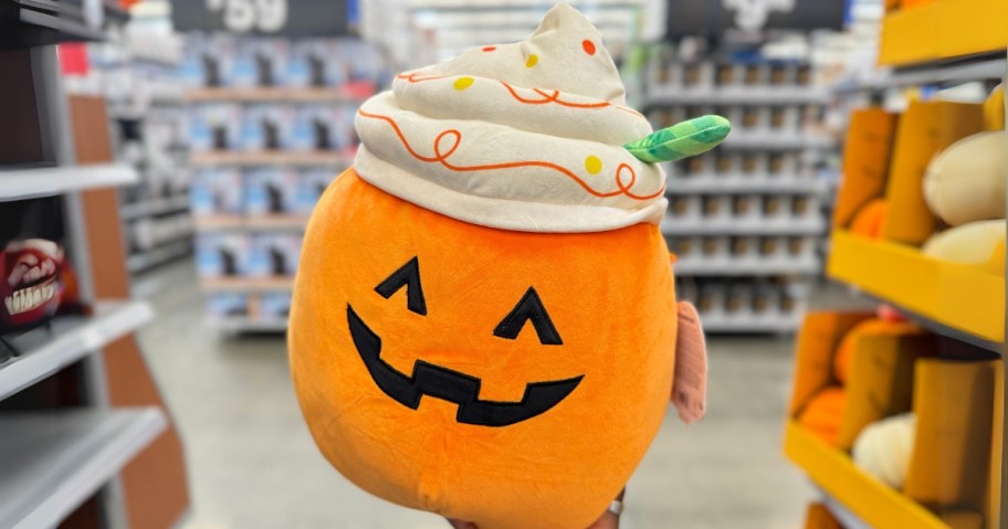 hand holding a Jackolantern Pumpkin Spice Latee Squishmallow