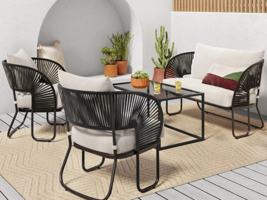 black rope back side chairs and loveseat patio set on outdoor patio