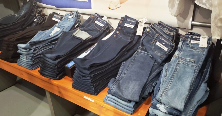 display table full of hollister skinny jeans in different washes