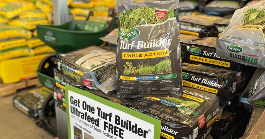 A display with Scotts Turf Builder BOGO sale at Home Depot