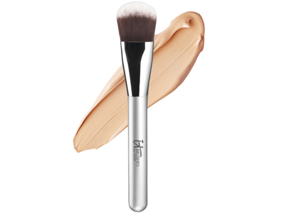 IT Cosmetics makeup foundation brush with makeup in the background