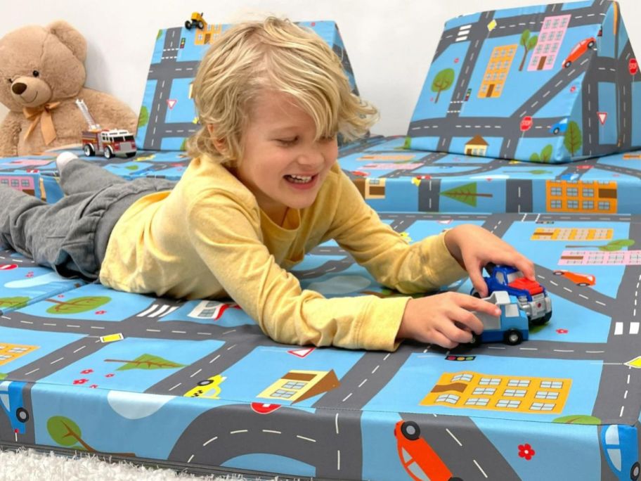 A child playing on a Imaginarium Kids and Toddler Play Couch, Road Map
