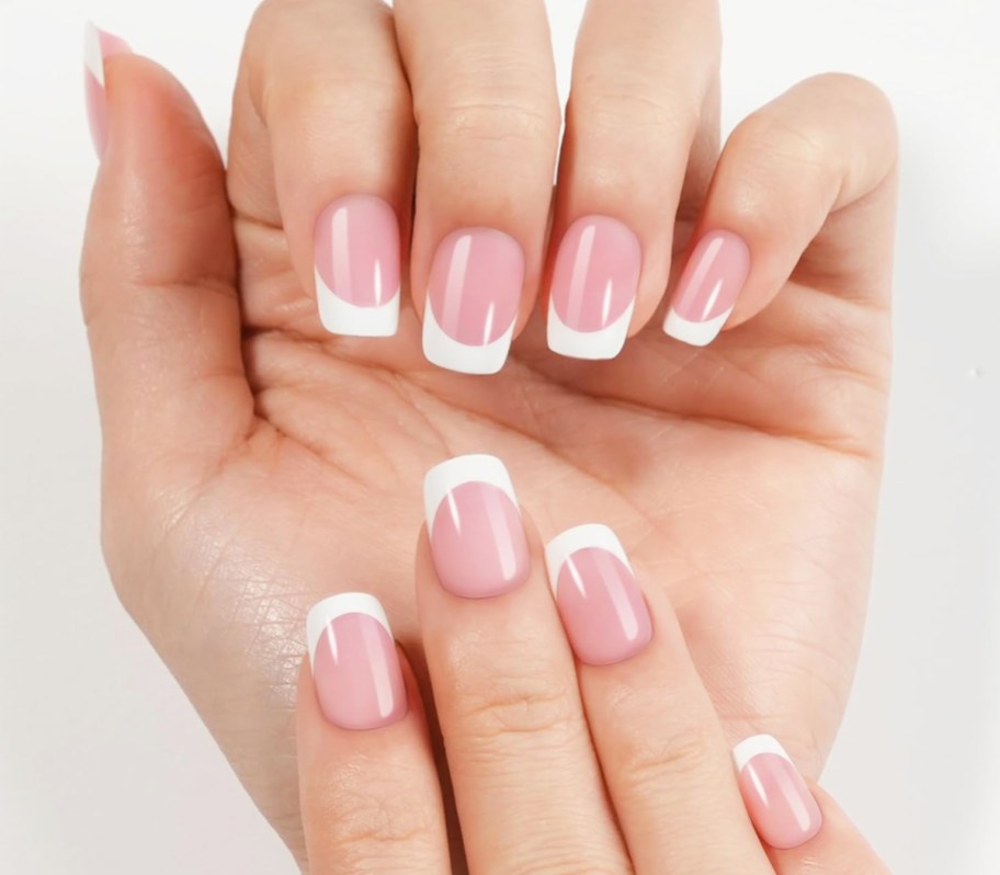 hand showing pink and white french manicure press-on nails