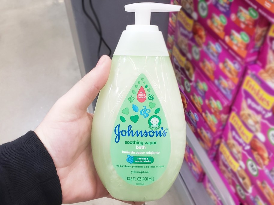 hand holding green bottle of Johnson's Baby Vapor Bath