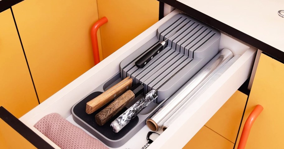 grey knife organizer inside kitchen drawer