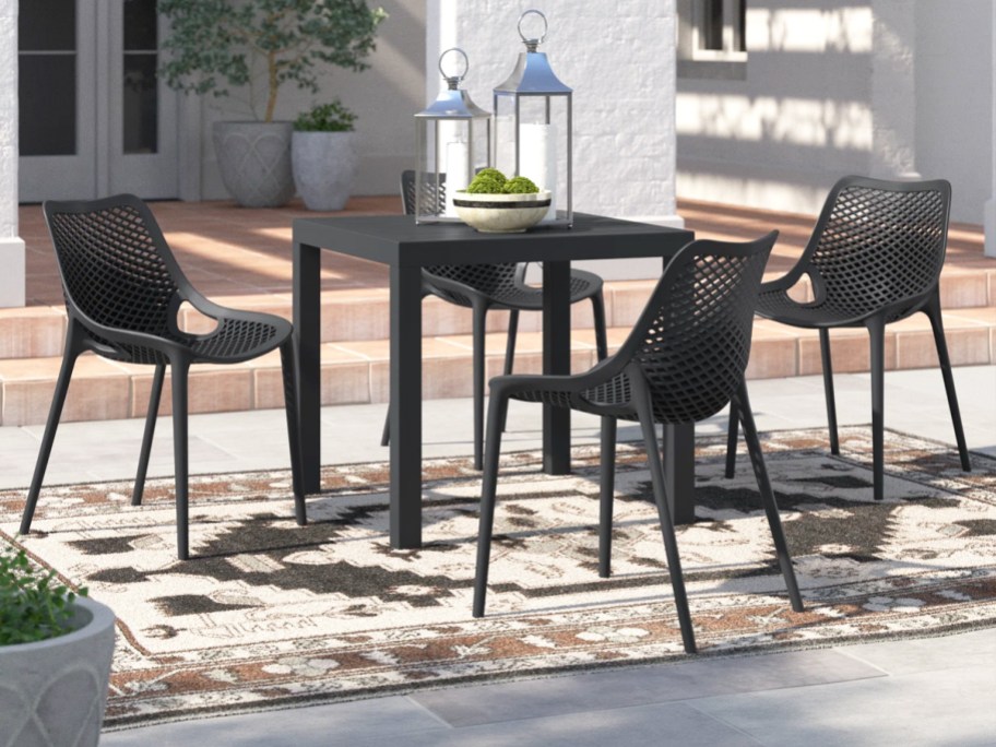 matching black patio table and chairs set